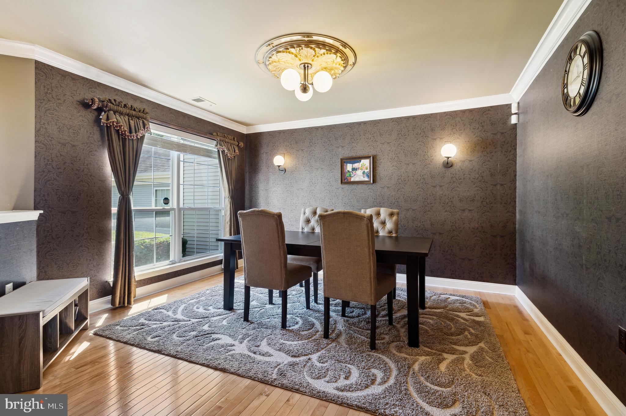 339 Watkins Road Pennington, NJ 08534 - Photo 13 of 32 a view of a dining room with furniture a chandelier and wooden floor