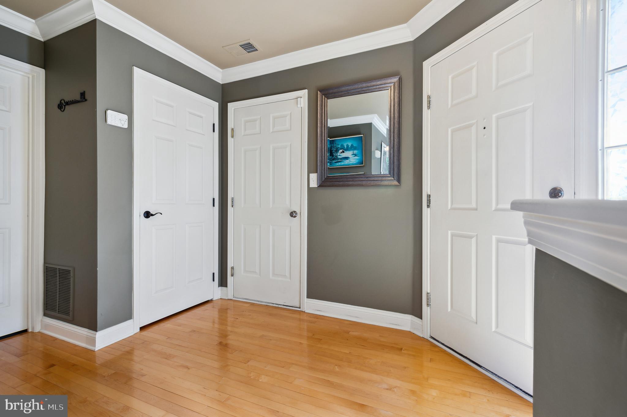 339 Watkins Road Pennington, NJ 08534 - Photo 3 of 32 a view of an empty room with wooden floor and a bathroom