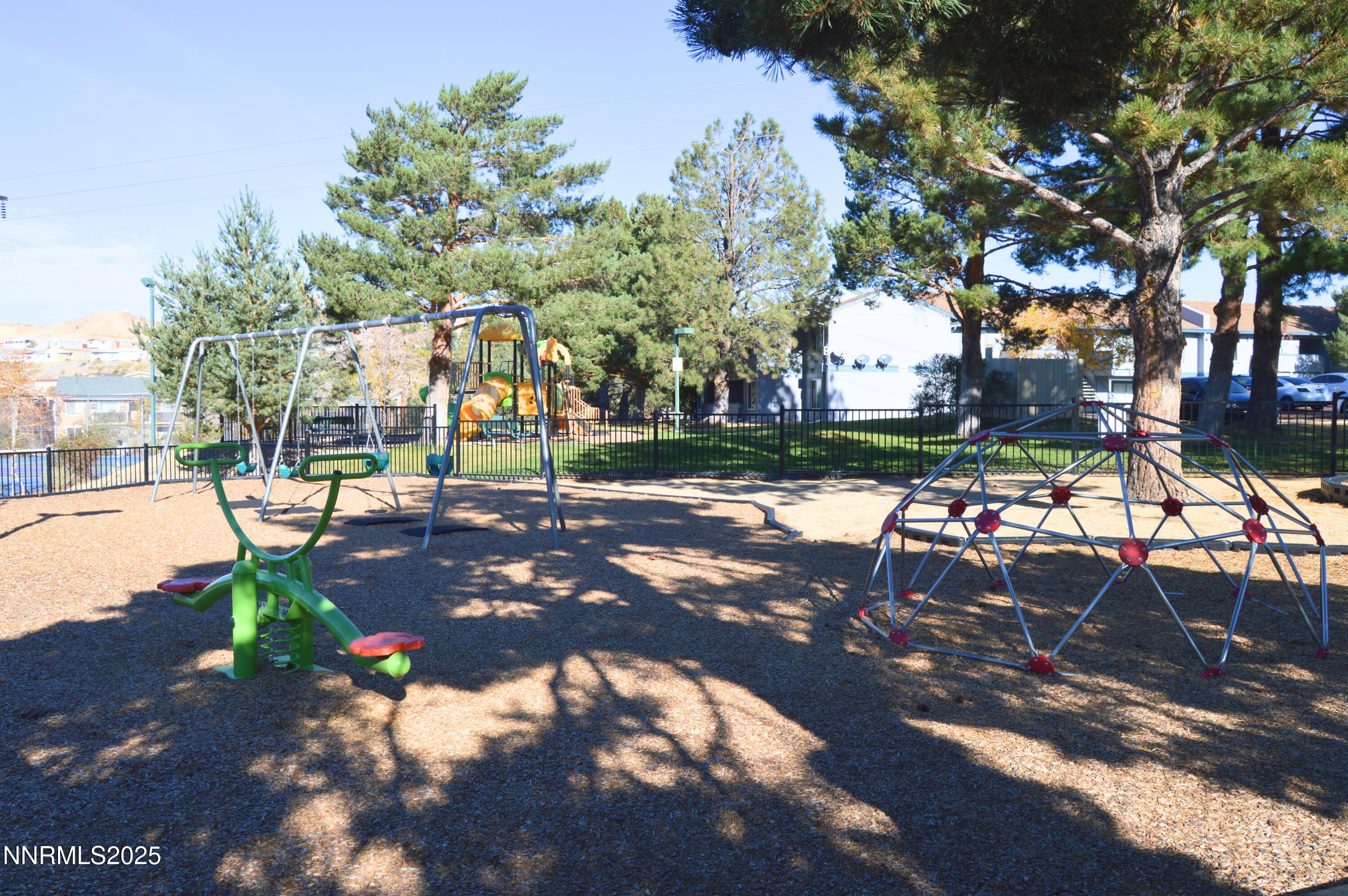 3915 Clear Acre Lane, Unit 149 Reno, NV 89512 - Photo 14 of 16 a view of a park with swings and slides