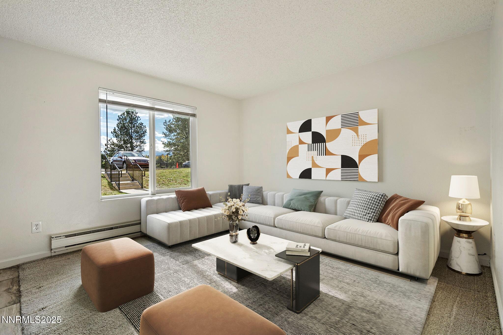 3915 Clear Acre Lane, Unit 149 Reno, NV 89512 - Photo 2 of 16 a living room with furniture and a window