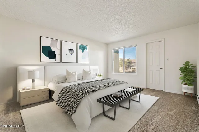 a bedroom with a bed and a couch