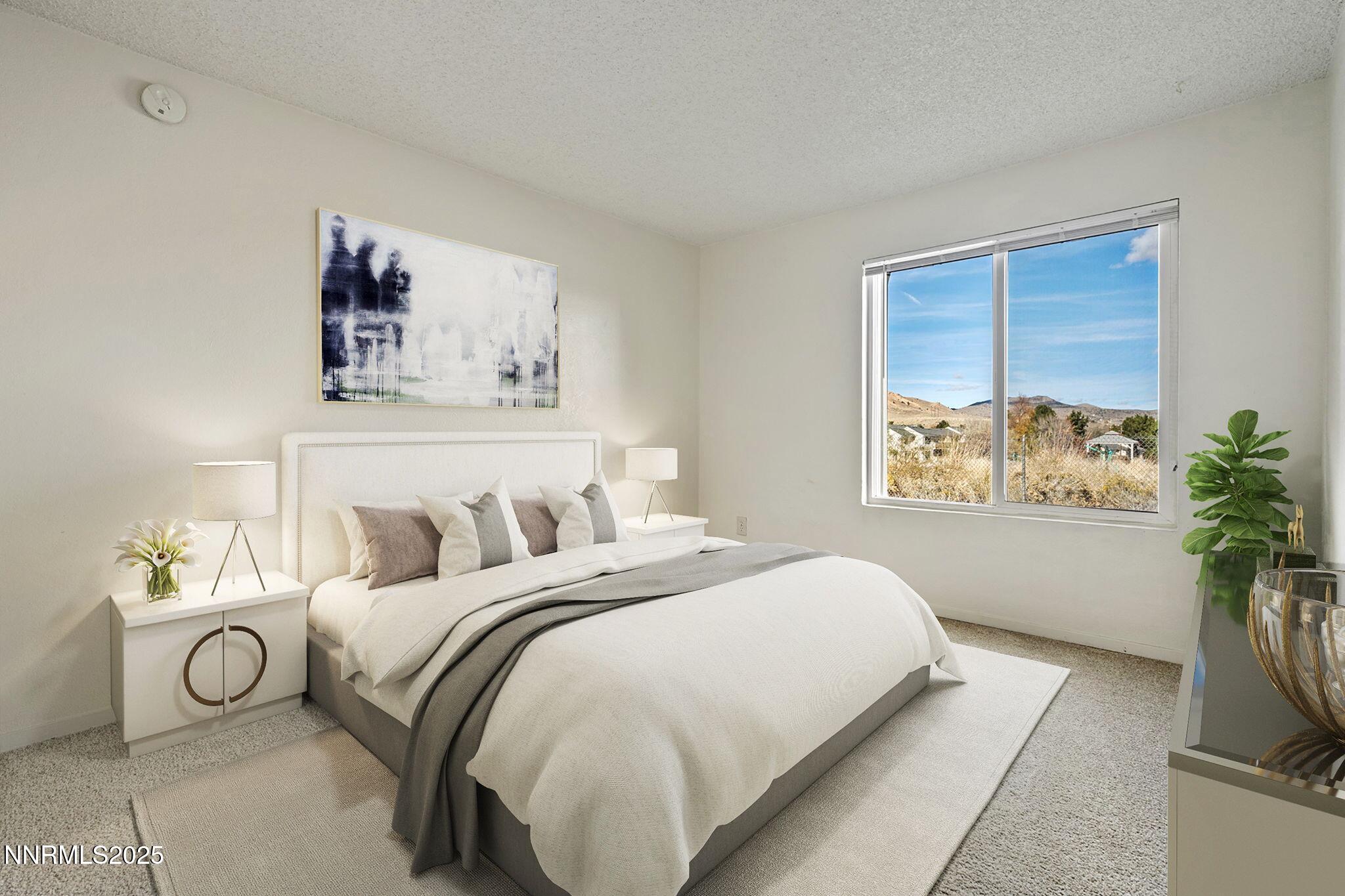 3915 Clear Acre Lane, Unit 149 Reno, NV 89512 - Photo 4 of 16 a bedroom with a bed and a window