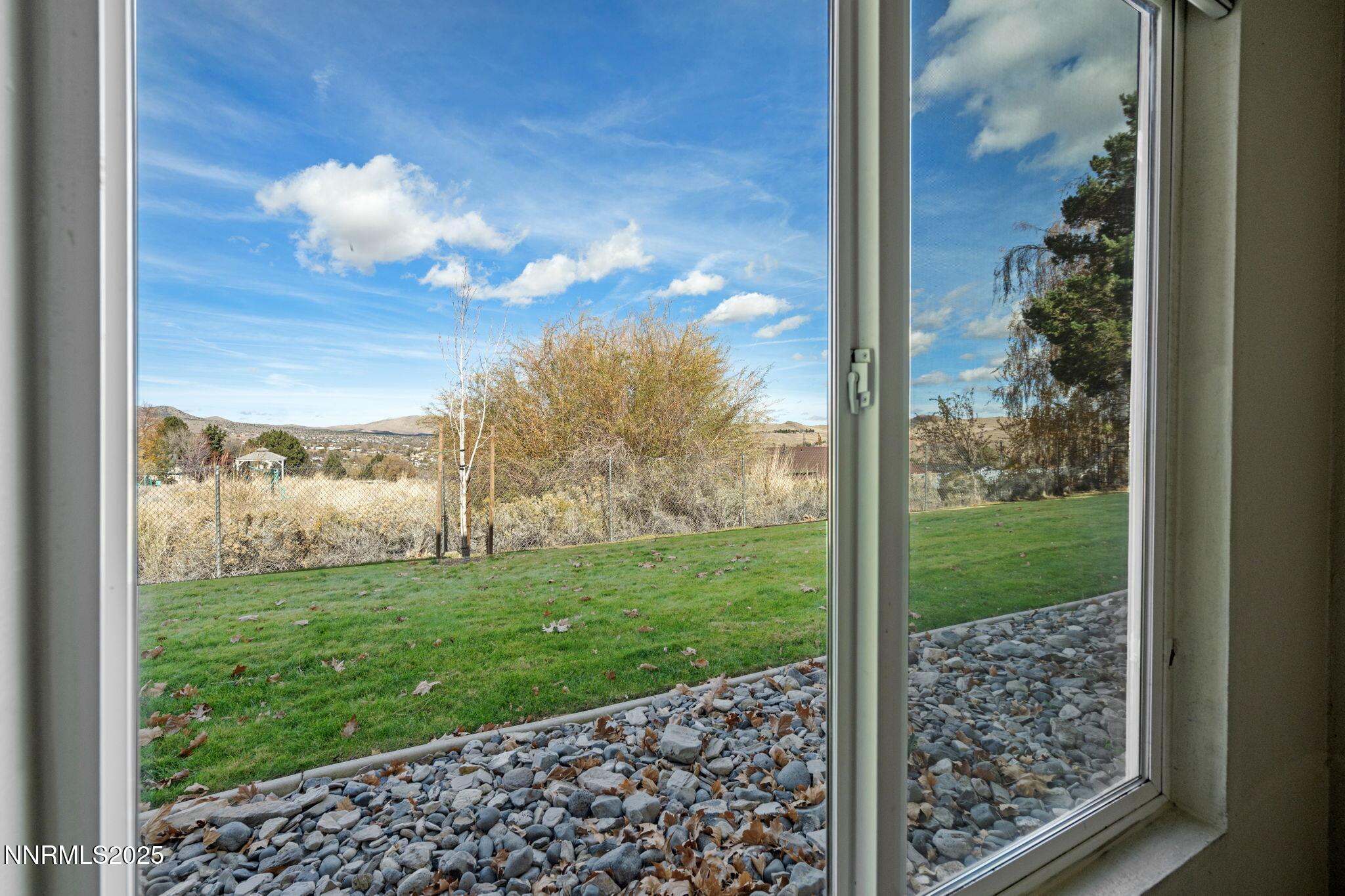 3915 Clear Acre Lane, Unit 149 Reno, NV 89512 - Photo 6 of 16 a view of a yard from a corridor