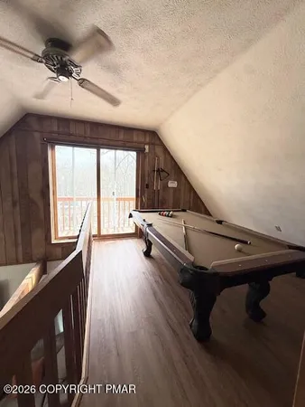 a living room with a car parked on the wall