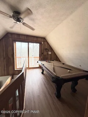 a living room with a car parked on the wall