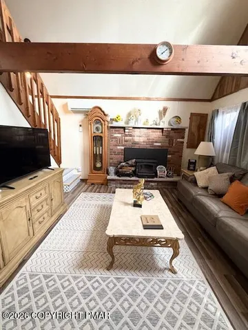 a living room with furniture and a flat screen tv