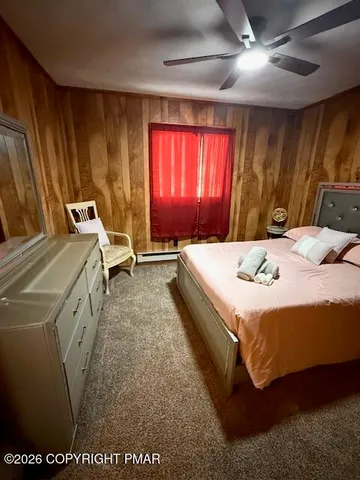 a bed room with a bed and a window