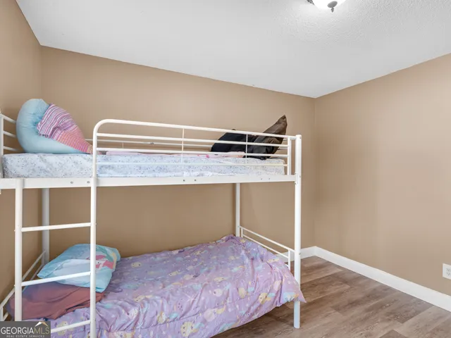 a bedroom with a bed and closet