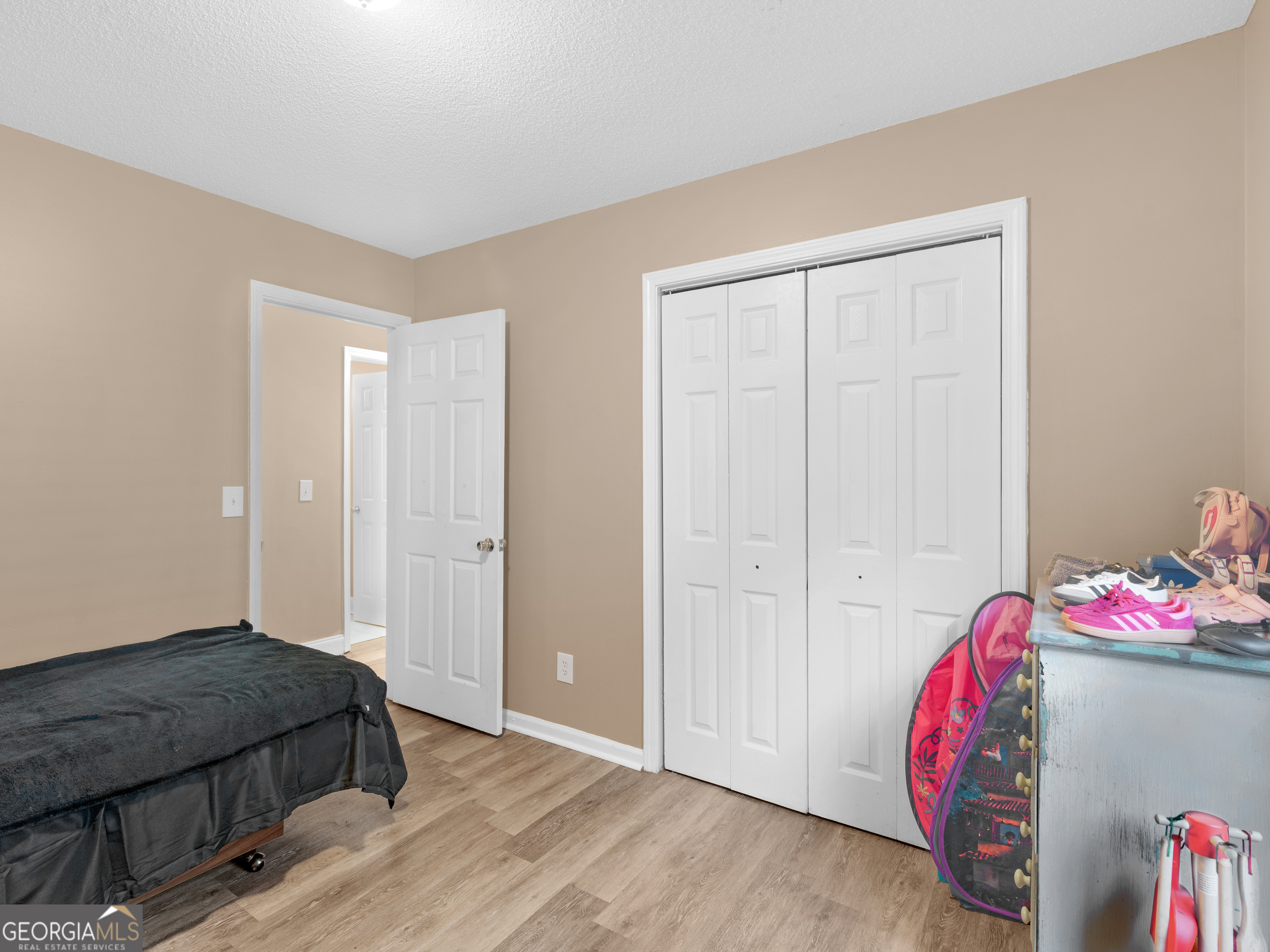 203 Pine Street Zebulon, GA 30295 - Photo 14 of 21 a bedroom with a bed and a closet