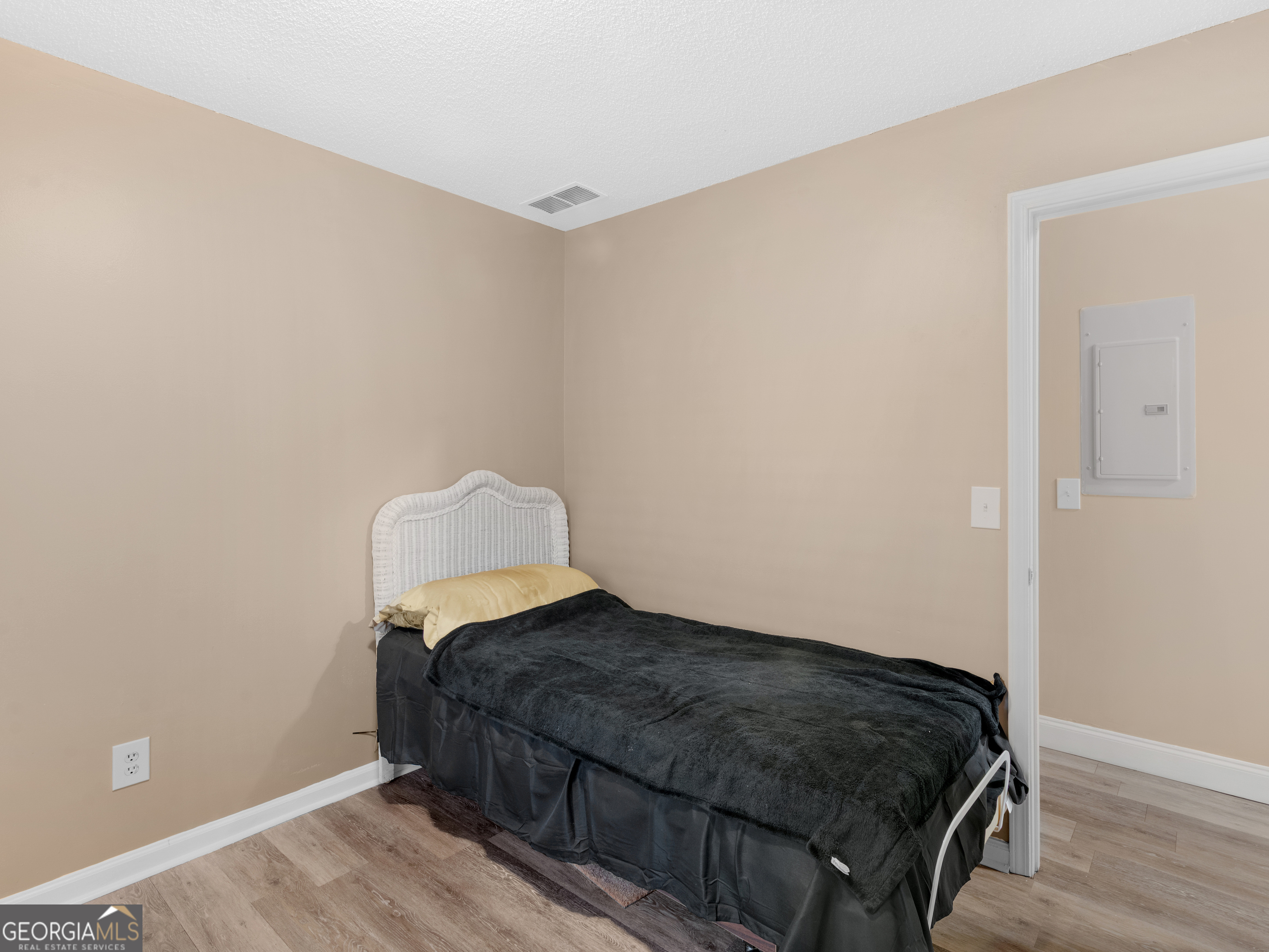 203 Pine Street Zebulon, GA 30295 - Photo 15 of 21 a bedroom with a bed and a window