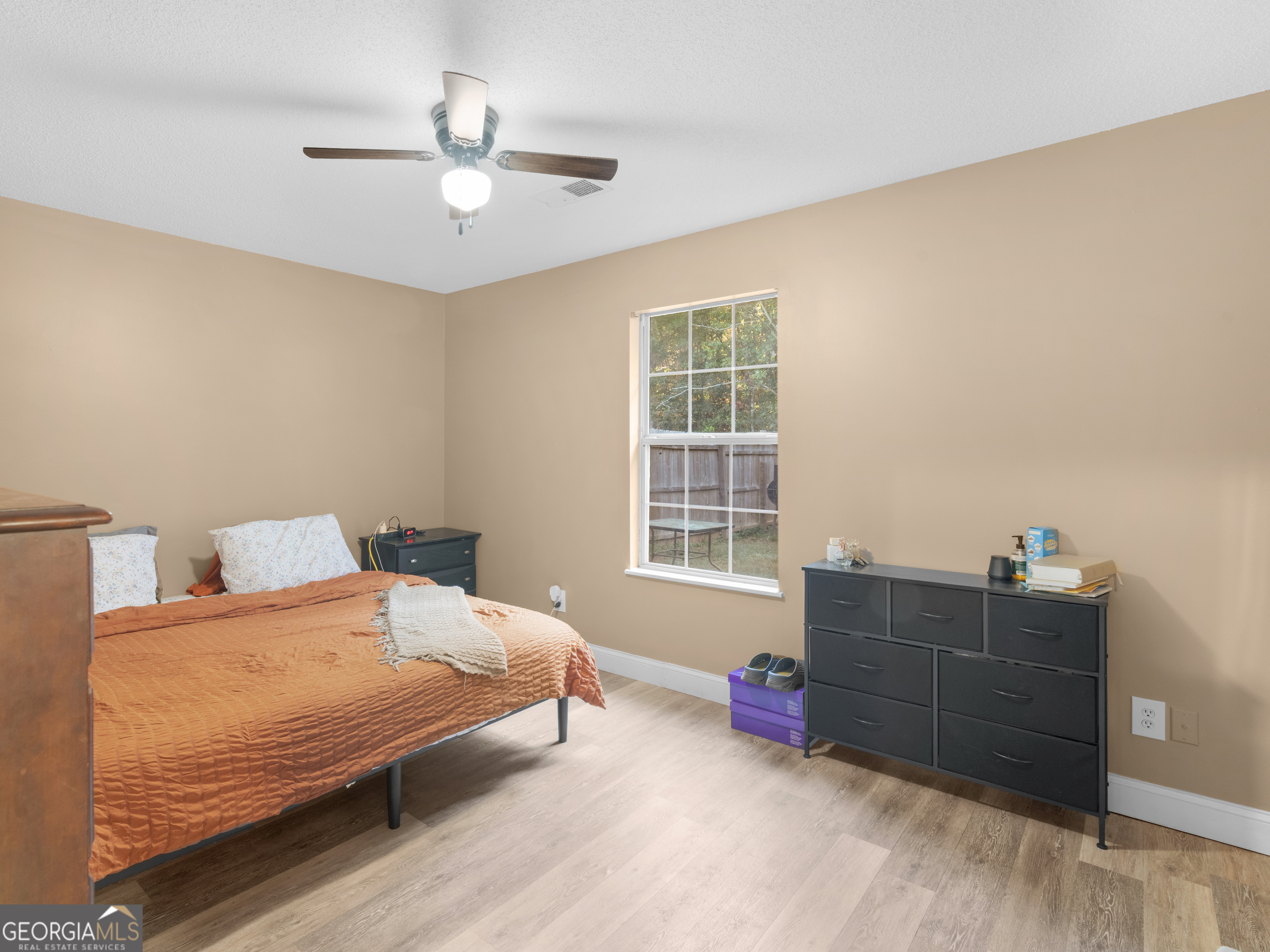 203 Pine Street Zebulon, GA 30295 - Photo 18 of 21 a bedroom with a bed and a window