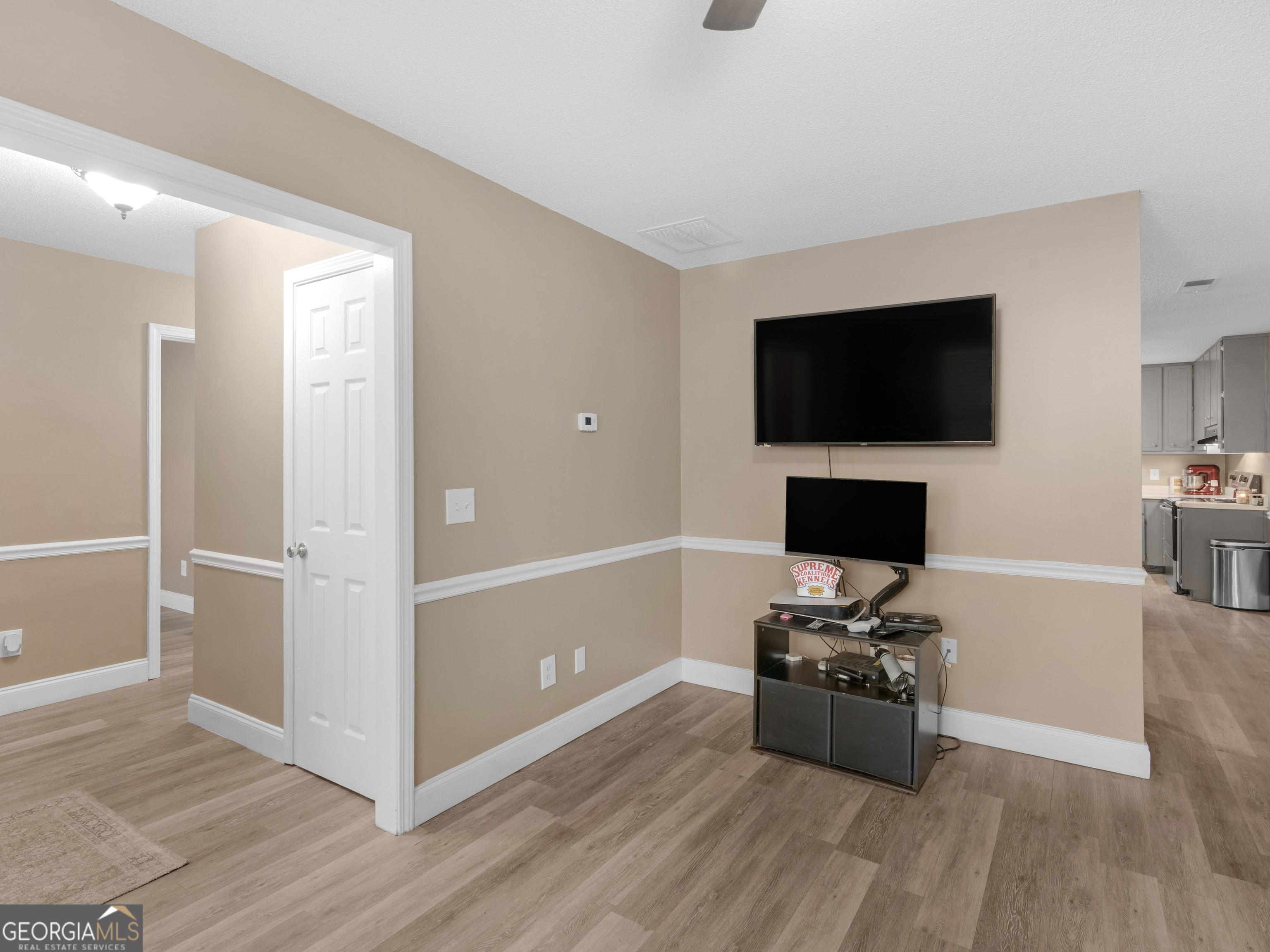 203 Pine Street Zebulon, GA 30295 - Photo 5 of 21 a bedroom with a bed and a flat screen tv