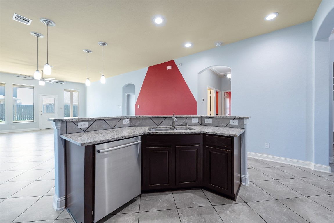 1908 Rushing Meadow Lane Pearland, TX 77089 - Photo 11 of 31 The kitchen overlooks the combined dining and living room.