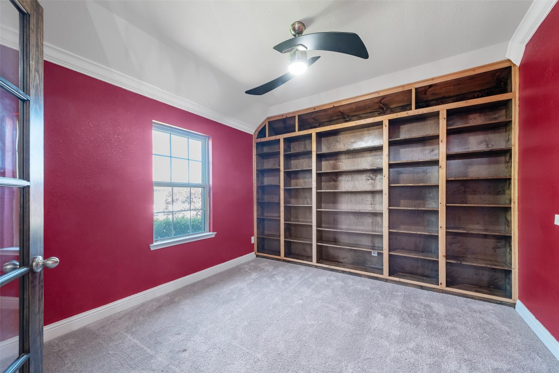 1908 Rushing Meadow Lane Pearland, TX 77089 - Photo 6 of 31 Study with wall of built-in shelving!