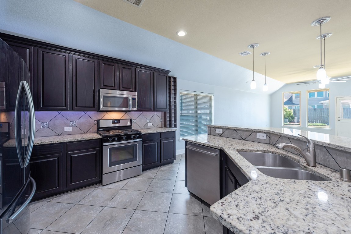 1908 Rushing Meadow Lane Pearland, TX 77089 - Photo 9 of 31 Plenty of cabinet space & granite countertops!
