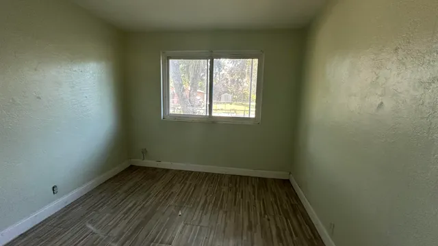 a kitchen with granite countertop a sink and a stove top oven