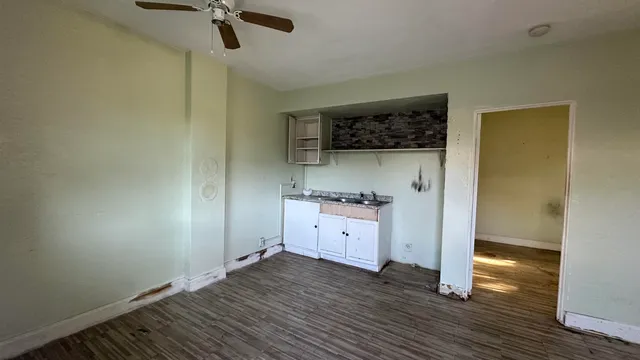 an empty room with a washer and dryer