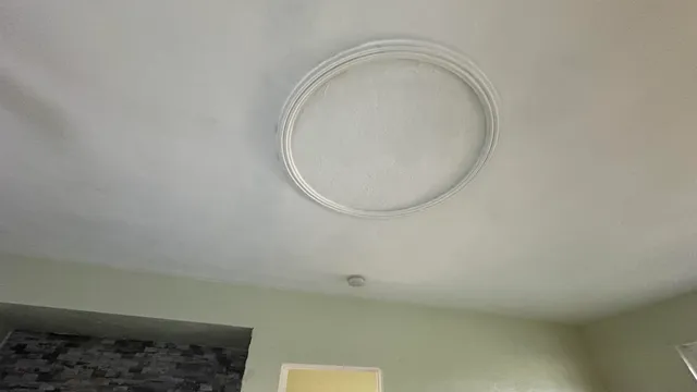 a kitchen with granite countertop a sink a stove and cabinets