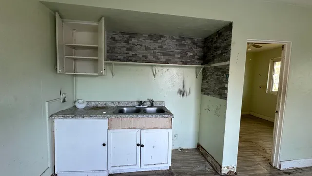 a picture of a cabinet with a white wall