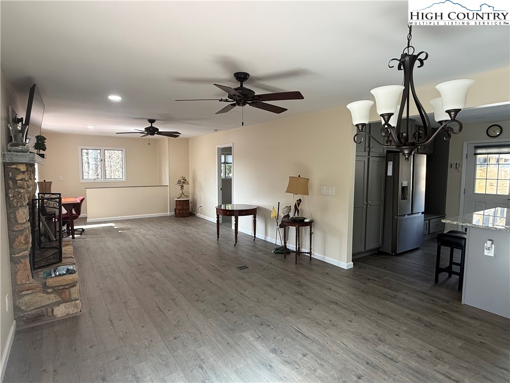 174 Spruce Pine Road Newland, NC 28657 - Photo 11 of 41 a view of a livingroom with furniture and a wooden floor
