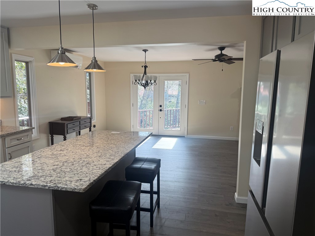 174 Spruce Pine Road Newland, NC 28657 - Photo 14 of 41 a view of a kitchen and a dining table chairs