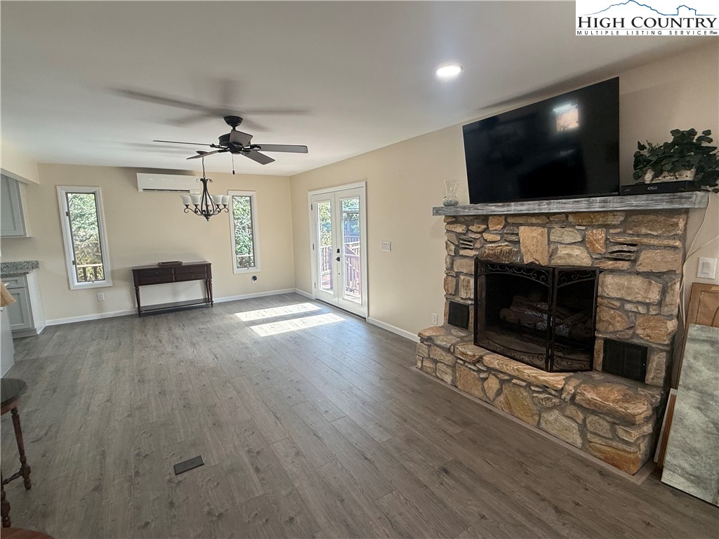 174 Spruce Pine Road Newland, NC 28657 - Photo 18 of 41 a living room with furniture and a flat screen tv