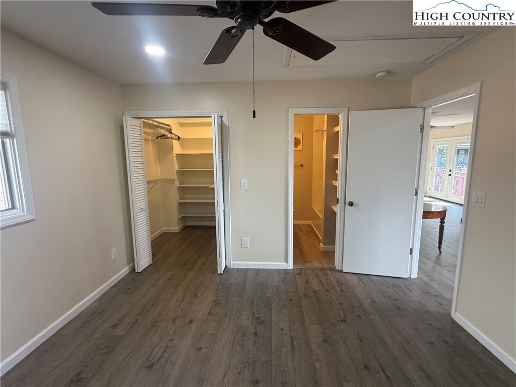 174 Spruce Pine Road Newland, NC 28657 - Photo 20 of 41 an empty room with wooden floor closet and windows