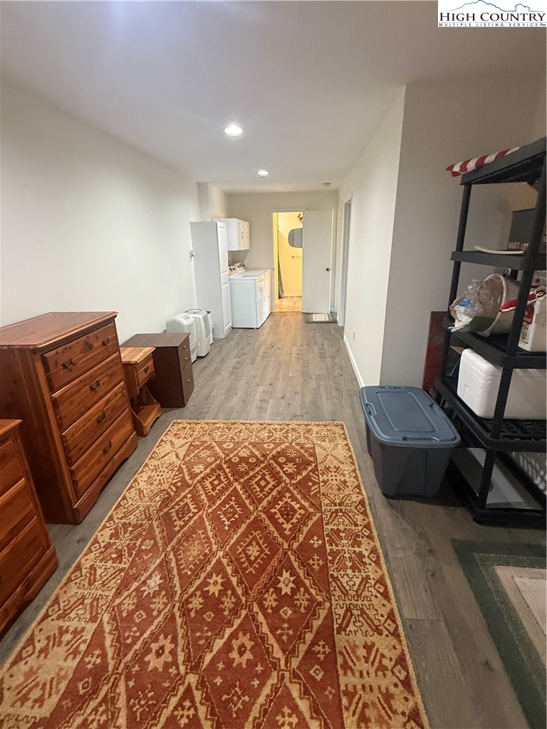 174 Spruce Pine Road Newland, NC 28657 - Photo 25 of 41 a bedroom with a bed and wooden floor