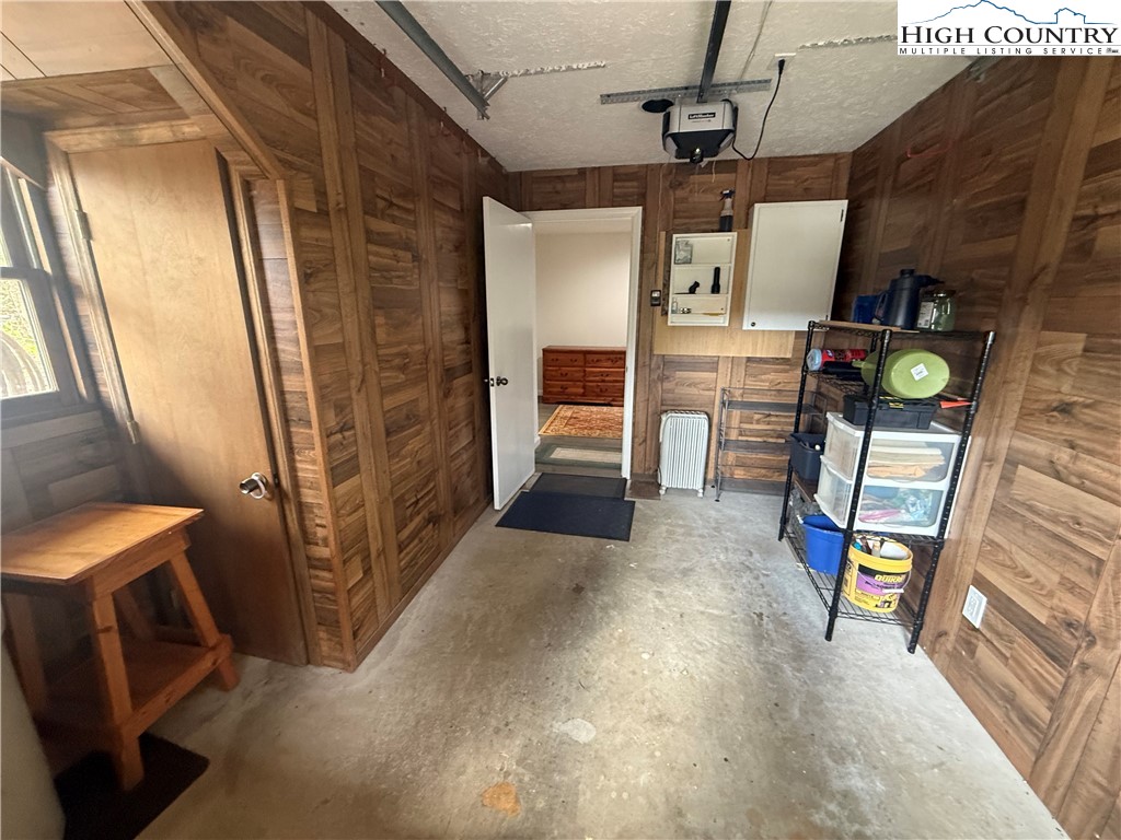 174 Spruce Pine Road Newland, NC 28657 - Photo 37 of 41 a view of an empty room with wooden floor