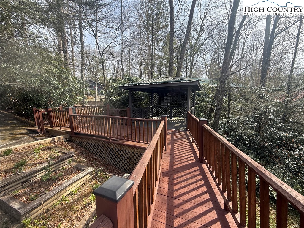 174 Spruce Pine Road Newland, NC 28657 - Photo 39 of 41 a balcony with wooden floor and trees