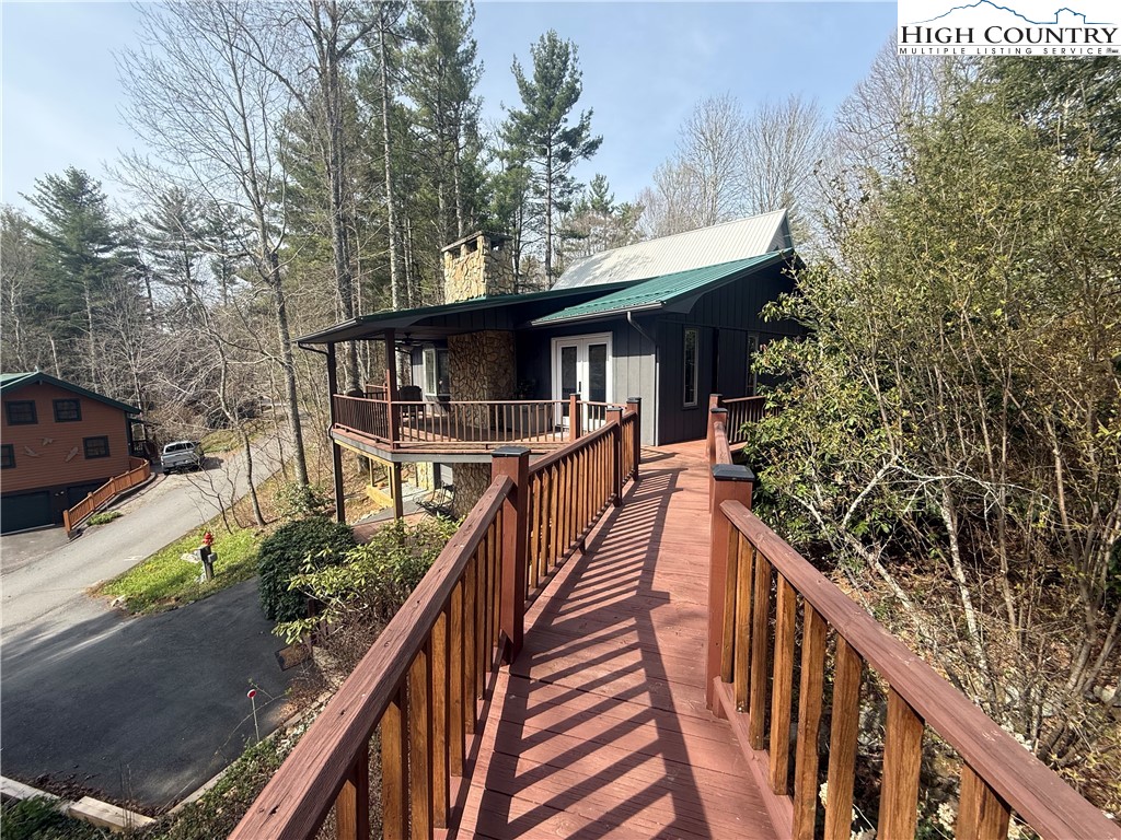 174 Spruce Pine Road Newland, NC 28657 - Photo 5 of 41 a view of a house with backyard and deck