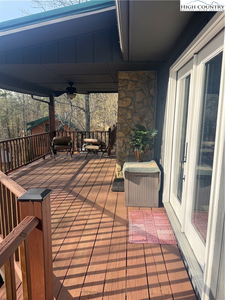 174 Spruce Pine Road Newland, NC 28657 - Photo 6 of 41 a patio with glass top table and chairs