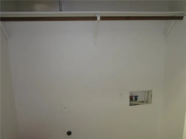 a view of a house with backyard and a tree