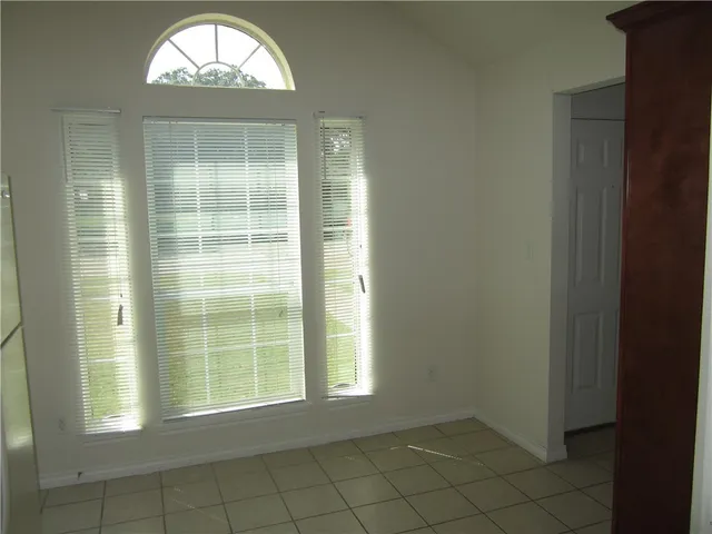 an empty room with a fireplace