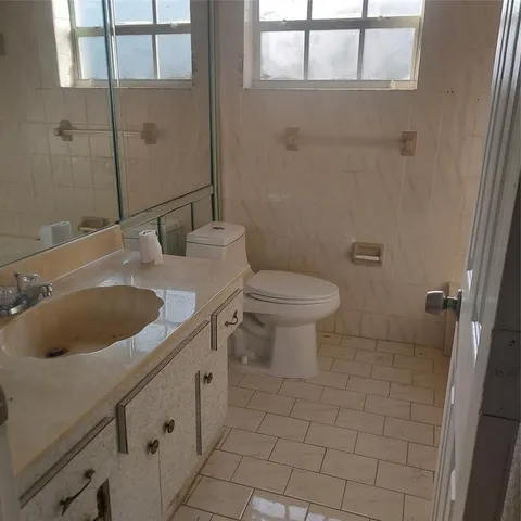 a bathroom with a sink toilet and vanity