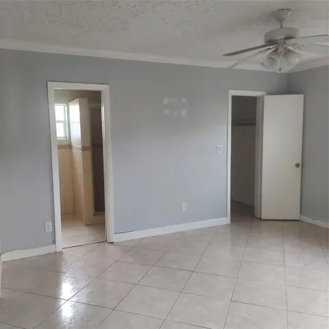 an empty room with a bathroom