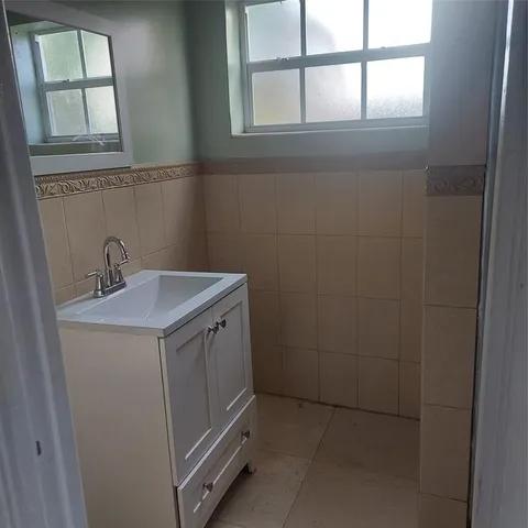 a utility room with a sink a washer and dryer