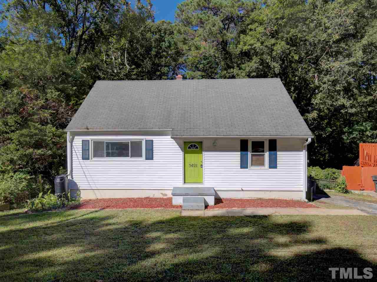 3421 Cheyenne Road Raleigh, NC 27609 - Photo 1 of 25 a aerial view of a house next to a yard with plants and large trees