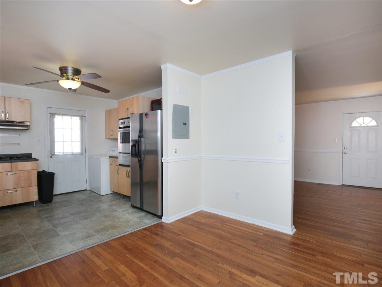 3421 Cheyenne Road Raleigh, NC 27609 - Photo 12 of 25 a view of a kitchen with wooden floor and a kitchen space