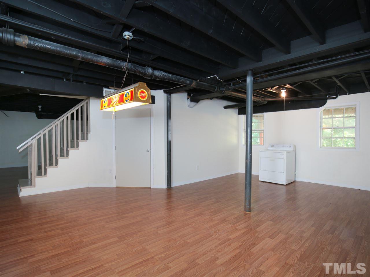 3421 Cheyenne Road Raleigh, NC 27609 - Photo 15 of 25 a view of a hallway with wooden floor