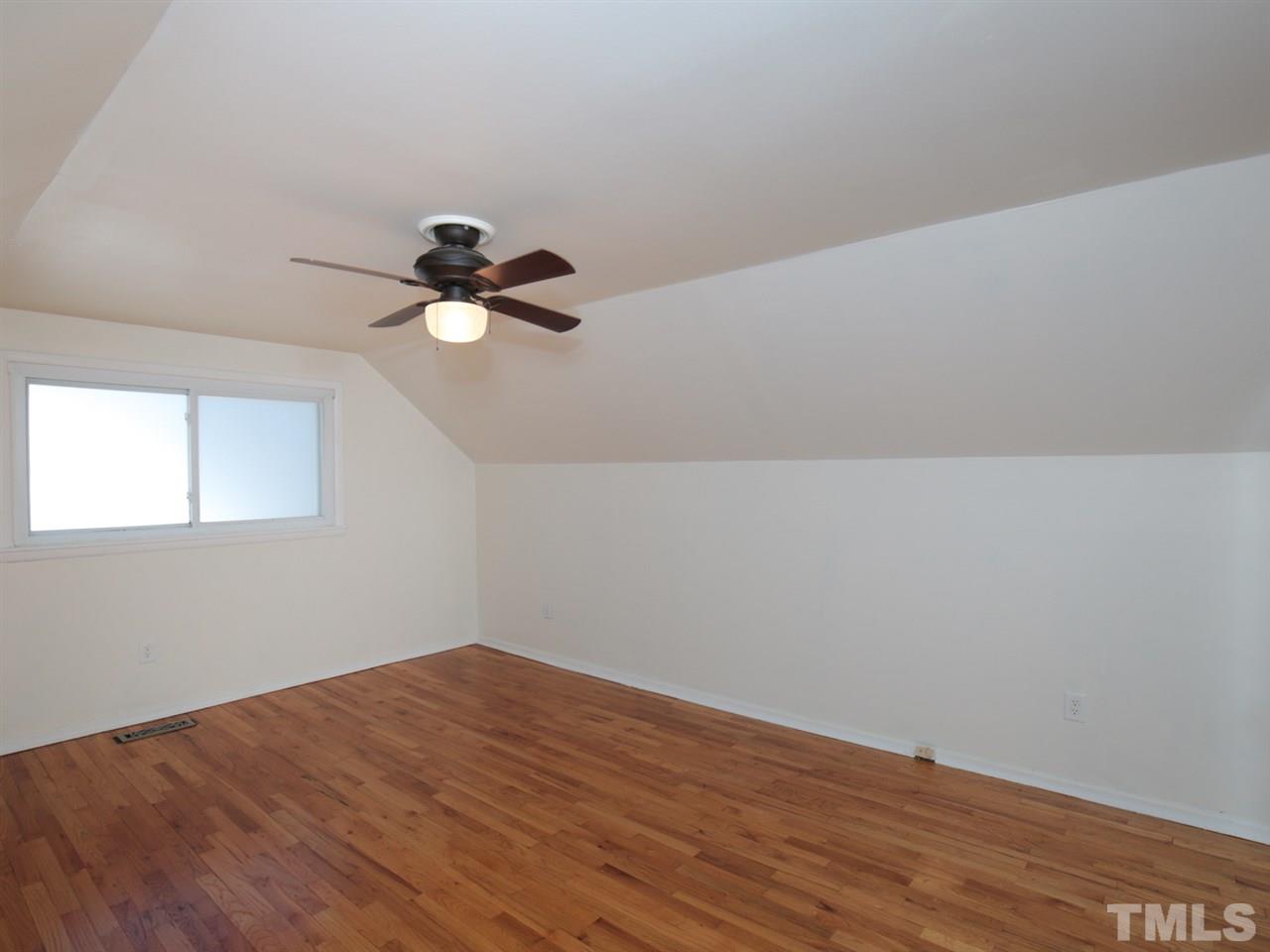 3421 Cheyenne Road Raleigh, NC 27609 - Photo 17 of 25 a view of empty room with wooden floor
