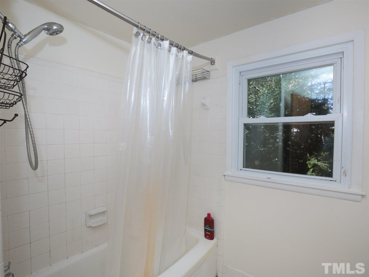 3421 Cheyenne Road Raleigh, NC 27609 - Photo 22 of 25 a bathroom with a shower and a window