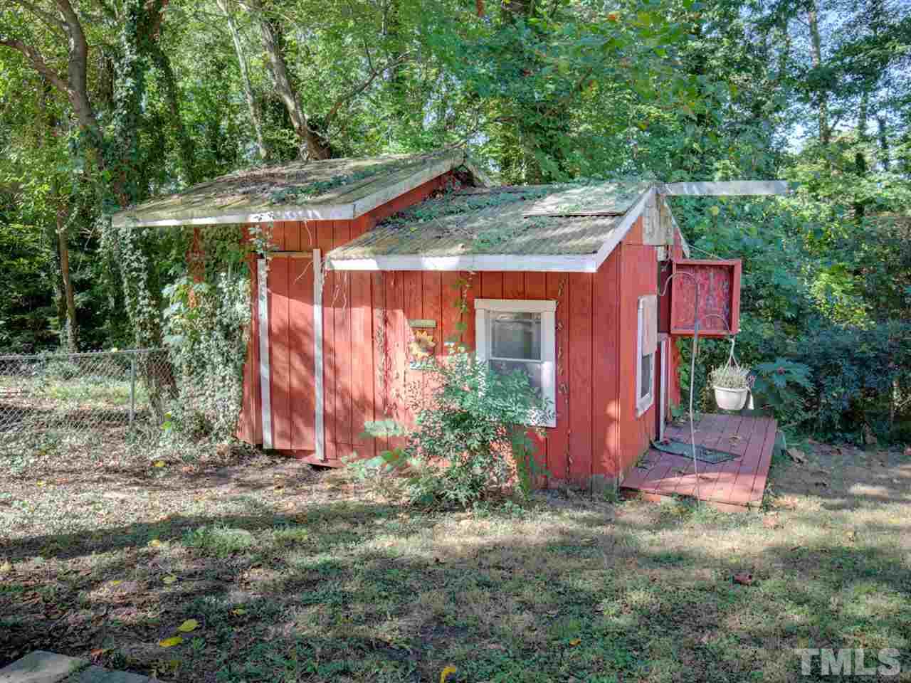 3421 Cheyenne Road Raleigh, NC 27609 - Photo 23 of 25 a view of a house with a yard potted plants