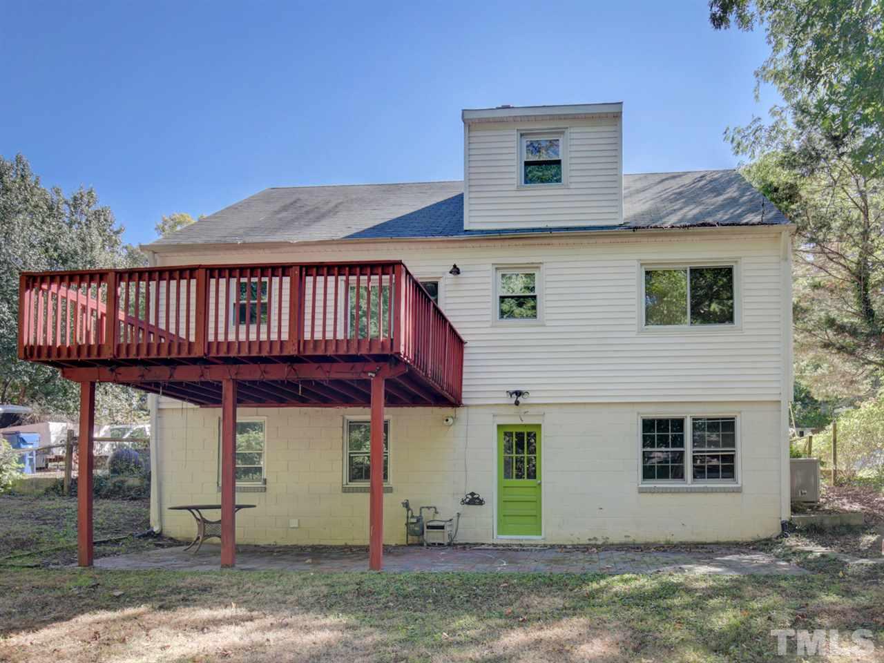 3421 Cheyenne Road Raleigh, NC 27609 - Photo 25 of 25 a view of a house with wooden deck and a tree