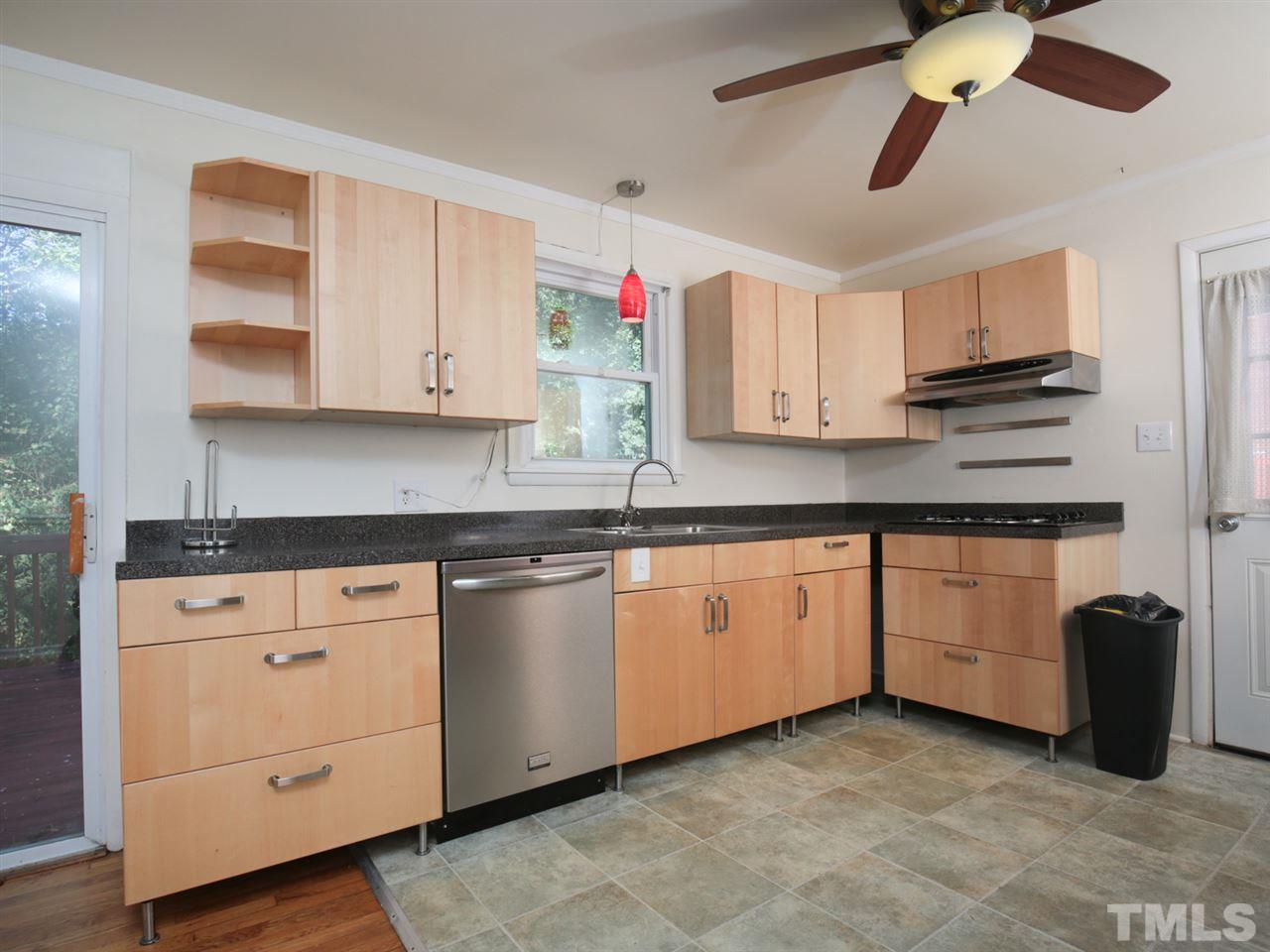 3421 Cheyenne Road Raleigh, NC 27609 - Photo 10 of 25 a kitchen with granite countertop a sink cabinets and stainless steel appliances