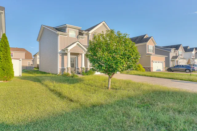 a house that has garden in front of it