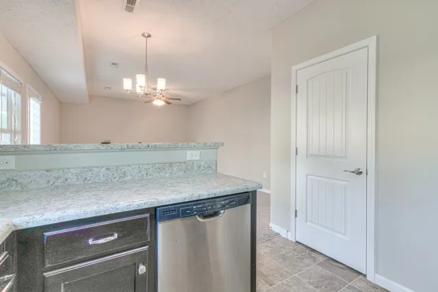 a view of a kitchen from the hallway