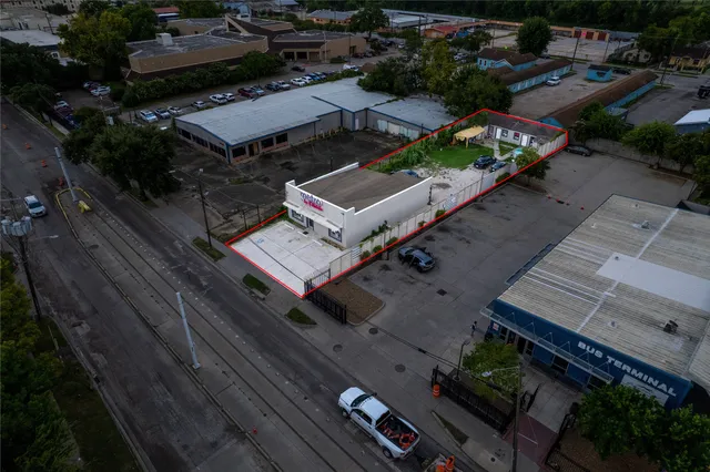 an aerial view of a house with a garden