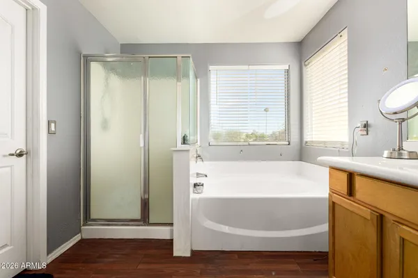 a bathroom with a bathtub and a sink