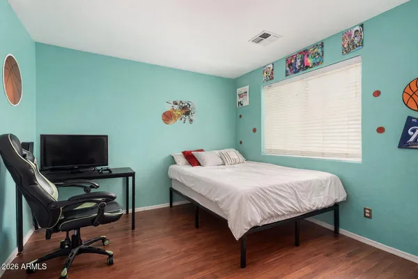 a bedroom with a bed and a window